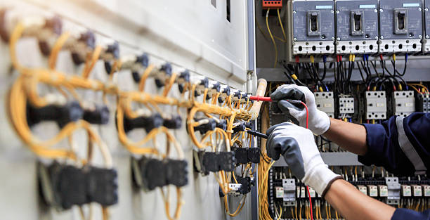 Professional Electrician technician working in Pine Hills, FL